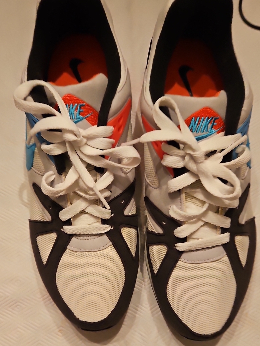 Nike White Sneakers with Black, Blue and Orange Accents